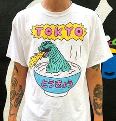 "High quality heavy cotton T-shirt. Designed by London based illustrator Gabriel Hollington. Model in the photo is 6\"1 and wearing a size L." Illustration Design Graphique, Graphic Shirt Design, Vintage Pop, Shirt Design Inspiration, Cartoon Dinosaur, Tokyo Fashion, Design Graphique, Dinosaur Print, Tee Design