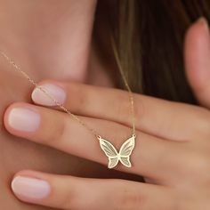 "Meet our elegant 14K Gold Butterfly Necklace, a dazzling piece that effortlessly combines elegance and nature-inspired beauty. This gold butterfly necklace is crafted with precision and attention to detail, making it the perfect accessory for those who value both style and sophistication. PRODUCT ∙ FEATURES: * Material: 14K solid gold provides lasting quality and shine. * Stunning Gold Options: Choose from Yellow gold for a classic touch, Rose gold for a hint of romance, or White gold for timel Luxury Gold Butterfly Necklace Fine Jewelry, Luxury Yellow Gold Elegant Butterfly Necklace, Yellow Gold Butterfly Necklace With Butterfly Clasp, Elegant Anniversary Butterfly Charm Necklace, Elegant Butterfly Jewelry As A Gift For Her, Elegant Butterfly Jewelry Gift For Her, Elegant Butterfly Necklace For Anniversary, Elegant White Gold Butterfly Necklace As Gift, Elegant White Gold Butterfly Necklace Gift