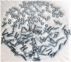 Nuts & Bolts Pack 1/8 dia. x 1/2 long (100 count).  Machine Screw.  Steel 4-40, Slot round head for use with straight flat head screwdriver tip.  Zinc plated. Nut And Bolt Size Chart, Flat Head Screwdriver, Nuts & Bolts, Nuts Bolts, Candle Tray, Nuts And Bolts, Flat Head, Strong Adhesive, Screwdriver