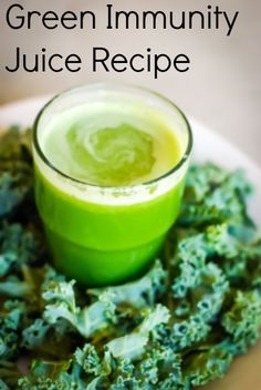 a green drink sitting on top of a pile of broccoli