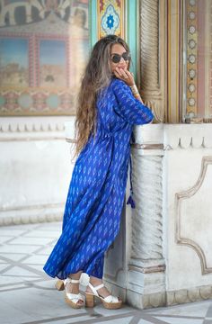 Our Brindisi Blue mercerized cotton maxi kaftan dress is the perfect BLUE dress! This amazing fabric is hand woven with a combination of very fine cotton yarns that create its incredibly vibrant, and piercingly beautiful colour! You can wear this maxi dress anywhere you want to brighten people's days! It is guaranteed to make everyone smile, mostly she who wears it. It is luxurious, comfortable, bright, and inimitable! Pax Philomena is proud to be supporting the artisans in India who still weave Maxi Kaftan, Perfect Blue, Ikat Fabric, Cotton Maxi, Kaftan Dress, Beaded Tassels, Dry Hands, Proud To Be, Blue Dress