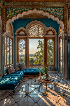 an ornate living room with large windows and blue couch in the center, overlooking trees