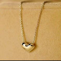 Beautiful Gold Plated Necklace With A Heart Elegant Yellow Gold Charm Necklaces With Heart Beads, Elegant Yellow Gold Charm Necklace With Heart Beads, Formal Jewelry With Heart Charm For Mother's Day, Classic Jewelry With Delicate Chain For Valentine's Day, Classic Delicate Chain Jewelry For Valentine's Day, Minimalist Silver Heart Necklace In 14k Gold, Silver Heart Necklace In 14k Gold For Mother's Day, Dainty Heart Charm Necklace For Formal Occasions, Classic Heart-shaped Jewelry With Heart Beads