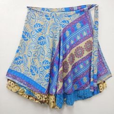 Indian Vintage Silk Wrap around magic long skirts for women, its free size wraps Reversible Tie skirts. Our skirt is handmade by our artisans in India out of recycled saris and turned into the beautiful finished skirt you see. With your help, these artisans are able to sustain year-round employment. Every skirt is truly an original made with exotic reclaimed materials. This skirt has the unique combination of designs and final touch of thread work on its corners which makes the product look arti Traditional Multicolor Long Wrap Skirt, Multicolor Belly Dance Skirt For Festivals, Blue Bohemian Wrap Skirt For Festival, Multicolor Wrap Skirt For Festivals, Traditional Flowy Wrap Skirt For Festival, Bohemian Flowy Skirt Bottoms For Festive Season, Blue Bohemian Flowy Wrap Skirt, Blue Long Wrap Skirt For Festival, Bohemian Skirt For Navratri