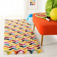 a brightly colored rug on the floor in a room