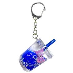 a blue cup with a pink bear in it is hanging from a metal keychain