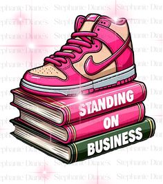 a pair of pink sneakers sitting on top of books with the words standing on business