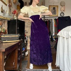 Vintage 60s velvet gown * Royal amethyst purple crushed velvet maxi dress * Crisp Edwardian cream bodice with satin sheen * Ruffled jabot collar & puff sleeves with delicate crochet hem * Metal zip back closure concealed under panel of fabric buttons * Empire waist fit with sleek A-line silhouette & crisp lining *  Super unique piece so a bit stumped on era - has unfinished seams, metal back zip, nylon horsehair braid hem.. my guess is 60s.  Tag reads "Triss". Vtg 10. Fits like a small. Very well made & in flawless condition.  Measures- Pit to pit: 17-17.5" Empire waist/ underbust: 14" True waist: 15" max  Hips: 22" Length: 56" I'm 5'7" - 36/25/38 for reference. Snug on bust Horsehair Braid Hem, Edwardian Fashion Dresses, 70s Mode, Jabot Collar, Horsehair Braid, Vintage Velvet Dress, Crochet Hem, 60s And 70s Fashion, Velvet Maxi