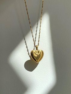 Sweet and chic gold heart necklace, drawing inspiration from the 90s rom-com movies. This classy heart pendant necklace is perfect for adding a little charm to your special holiday occasions. ♡MATERIAL♡ 18k gold PVD coated stainless steel, anti-tarnish and waterproof ♡NECKLACE LENGTH♡ 15.5" + 2" extender, singapore chain, the necklace length can be adjusted to 17.5" max Necklace length is measured end to end, including clasp.  ♡PENDANT MEASUREMENT♡ 22mm*22mm(W*H) ♡SHIPPING♡ - We ship the next bu Pendant Necklace Vintage, Necklace Heart, Gold Heart Necklace, Necklace Vintage, Style Statement, Gold Heart, Heart Pendant Necklace, Necklace Gift, Heart Of Gold