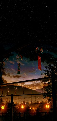 lanterns hanging from the ceiling in front of a night sky