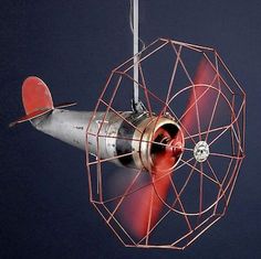 an airplane is flying in the sky with red propellers