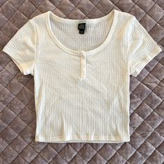 Button Up Pleated Baby Tee. Brand New Without Tags And Never Worn. Pet And Smoke Free Home. Cute Cotton Tops With Button Closure, White Buttoned Top For Everyday Wear, White Fitted T-shirt With Button Closure, Basic Short Sleeve Tops With Buttons, Basic Tops With Button Closure For Summer, Basic Spring Tops With Button Closure, Basic Button-up Top, Basic Tops With Button Closure For Spring, Cute White Tops With Buttons