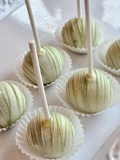 white chocolate covered candies are lined up on a table