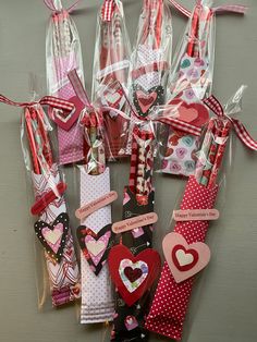 valentine's day candy wrappers are arranged in a heart pattern and tied with ribbon