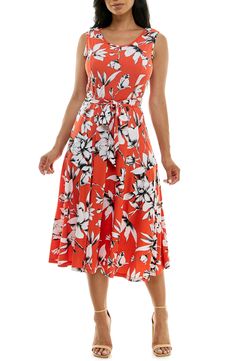 A vibrant printed midi dress is perfect for summer events. Fit: this style fits true to size. 50" length (size Medium) Crewneck Sleeveless Attached waist tie 95% polyester, 5% spandex Machine wash cold Imported Model stats: 5'10", 32" bust, 25" waist, 36" hip. Model is wearing size Medium. Printed Sleeveless Dress For Garden Party, Summer Printed Sleeveless Dress For Garden Party, Summer Garden Party Printed Sleeveless Dress, Printed Midi Length Summer Sundress, Printed Midi Length Sundress For Summer, Printed Midi Sundress For Summer, Printed Sleeveless Dress For Spring Garden Party, Spring Printed Sleeveless Dress For Garden Party, Summer A-line Maxi Dress With Tie Waist