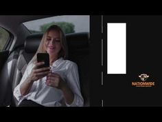 a woman sitting in the back seat of a car looking at her cell phone