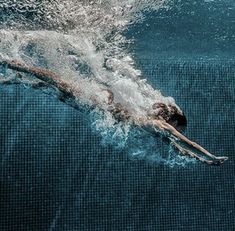 a person is swimming in the water