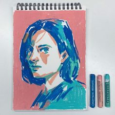 a drawing of a woman with blue hair and three crayons next to it