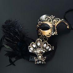 The man pays tribute to the iconic musical in the black/gold mask and the woman looks elegant with the black/gold mask, which comes attached with feathers. Black And Gold Masquerade Mask, Phantom Mask, Masquerade Mask Women, Gold Masquerade Mask, Masquerade Theme, Feather Mask, Gold Mask, Mask Masquerade, Photo Mask