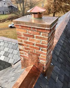 a brick chimney on top of a roof