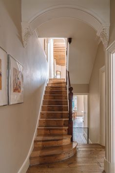 a wooden staircase leading up to the second floor