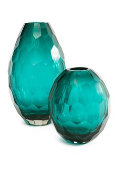 two green vases sitting next to each other