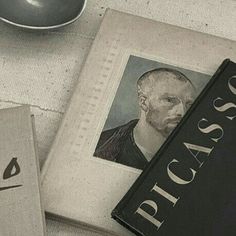 two books sitting on top of a table next to a computer mouse