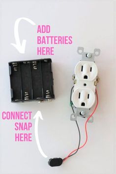 an electrical outlet is connected to two batteries