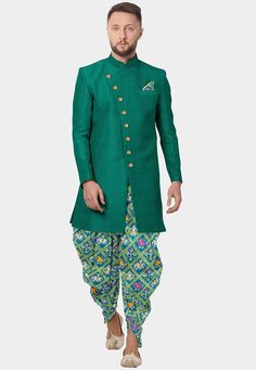 Readymade Art Silk Sherwani Dhoti Set in Teal Green. This Chinese Collar and Full Sleeves attire with Satin Lining is Enhanced with Patola Printed With Animal Motif Dhoti and Top Enhanced With Buttons, Printed Pocket Square And Side Pockets. Available with a Art Silk Dhoti Pant in Sea Green. Do note: Footwear shown in the image is for presentation purposes only. Half to one inch may vary in measurement. (Slight variation in actual color vs. image is possible) We sell all kinds of menswear. Mens Traditional Drape Kurta In Pista Green For Transitional Season, Pista Green Traditional Drape Kurta For Transitional Season, Transitional Traditional Drape Pista Green Kurta, Designer Kurta With Traditional Drape For Navratri, Designer Traditional Drape Kurta For Navratri, Green Semi-stitched Bandhgala With Resham Embroidery, Pista Green Salwar Kameez With Traditional Drape, Green Nehru Jacket With Resham Embroidery For Diwali, Diwali Green Nehru Jacket With Resham Embroidery