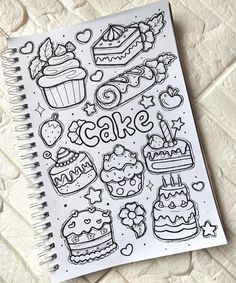 a notebook with doodles on it that says cake and cupcakes in the background