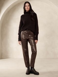 We selected a luxurious quality of vegan leather for this jogger-style pant, cut with a mid-rise and a slim, tapered leg.  Mid rise.  Slim, tapered leg.  Ankle length.  Elastic waistband with drawstring.  Front pockets.  Unlined.  Mid rise (9").  Slim through the hip and thigh, tapered leg.  Ankle length.  Inseams: Petite/Short 25", Regular 27", Tall 30" Model: Size S, 5'10" (178cm). Leather Joggers, Style Pant, Petite Shorts, Banana Republic Pants, Fashion Joggers, Classy Chic, Sporty Chic, Fall 2023, Ankle Length