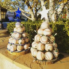 two christmas trees made out of baseball balls