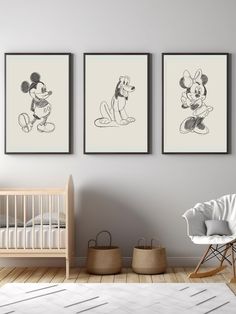 three disney mouses are hanging on the wall next to a baby's crib