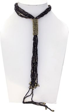 Diffused Black Beads get together in a tie around neck and come all the way down to the waist in this Black Beads Necklace with Metal Silver on the tie. The length is 28 inches, with no hooks (i.e one size), and the drop is for 12 inches. Adjustable Beaded Necklace With Large Beads For Party, Adjustable Long Beaded Necklace With Black Beads, Adjustable Black Beads Lariat Beaded Necklaces, Adjustable Beaded Lariat Necklace For Parties, Adjustable Lariat Beaded Necklace With Black Beads, Adjustable Lariat Beaded Necklaces For Parties, Party Lariat Necklace With Faceted Beads, Beaded Long Lariat Necklace For Party, Beaded Lariat Necklace For Party