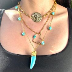 This striking, handcrafted triple-layered necklace is plated in 24K gold and adorned with turquoise Howlite stones and a San Benito coin. Designed to elevate any outfit, this piece features a perfect balance of elegance and spirituality. Each layer has been meticulously crafted to create a cohesive and harmonious look, making it an eye-catching statement necklace.  Gemstone Benefits: *Turquoise Howlite: Known for its tranquil energy, Howlite is believed to promote calmness and stress relief. It Triple Layer Necklace, Diy Jewelry Necklace, Howlite Stone, Sacred Symbols, Turquoise Howlite, Necklace Gemstone, Layered Necklace, Jewelry Necklace, Gold Plated Jewelry