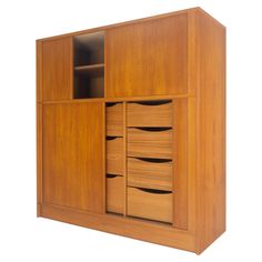 a large wooden cabinet with drawers and doors