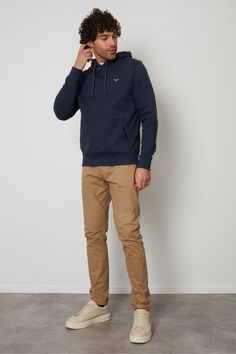 This pull-on hoodie from Threadbare features a kangaroo pocket, elasticated cuffs and hem and an adjustable drawstring hood. Style simply with a pair of matching joggers for laidback loungewear, or team with jeans and trainers for a casual outfit for your weekend outings. Made in a cotton blend fabric to ensure a really comfortable feel. Other colours and matching items available. Machine washable. 60% Cotton, 40% Polyester. Navy Hoodie Outfit Men, Mens Joggers Outfit, Blue Hoodie Men, Hoodie Outfit Men, Brand Recognition, Navy And Orange, Joggers Outfit, Navy Hoodie, Blue Pullover