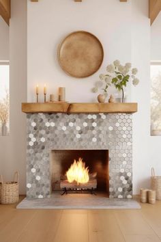 a living room with a fire place in the center and candles on top of it