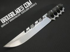 a knife that is sitting on top of a black surface with the words brubblads com