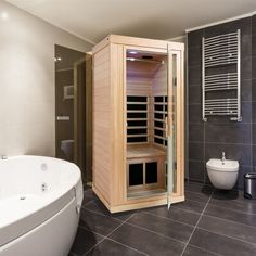 a bathroom with a sauna in the corner