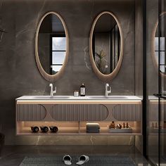 a bathroom with two sinks and mirrors on the wall