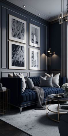 a living room with blue couches and pictures on the wall above them, along with coffee table