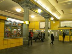 people are walking around in the subway station