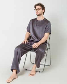 Type: Men's 2-piece silk pajama setMaterial: 19 Momme Charmeuse Silk. Details:Introducing our luxurious men's silk pajama set, a perfect blend of comfort and sophistication. Crafted from premium silk fabric, this set features a short-sleeved top with a stylish crew neckline and matching long pants, creating a cohesive and effortlessly elegant look for your nighttime relaxation. The breathable and smooth texture of silk ensures a soothing and comfortable sleep experience, while the modern design Loungewear Wardrobe, Mens Silk Pajamas, Silk Pajamas Set, How To Wash Silk, Silk Pajama, Silk Pajama Set, Slumber Party, Luxury Silk, Silk Shorts