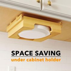 an advertisement for space saving under cabinet holders