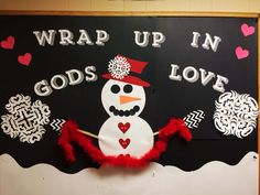 a bulletin board with a snowman on it that says wrap up in god's love