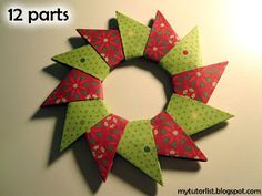 an origami christmas wreath made out of red and green paper with the words 10 parts