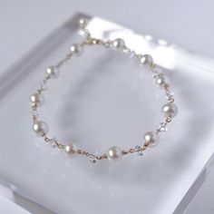 This dainty hand wrapped beaded bracelet is elegantly designed with freshwater cultured pearls and diamond shaped cubic zirconia stones. Modern and timeless, this freshwater cultured pearl and clear cubic zirconia bracelet is perfect for a classic looking. Perfectly embodies minimalist aesthetics, this beaded pearl bracelet makes the perfect addition to any jewelry collection. Handmade in USA. ▷ AA+ quality freshwater pearls with high luster and flawless surface. ▷ Diamond shaped cubic zirconia. Silver Bracelet Aesthetic, Bridal Pearl Bracelet, Real Pearl Bracelet, Bridal Bracelet Pearl, Bracelet Extender, Pearl Bracelet Wedding, Cubic Zirconia Bracelet, Quotes Instagram, Bracelet Wedding