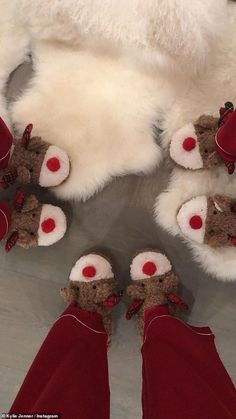 the teddy bears are wearing red and white outfits