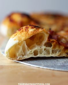 half eaten pizza sitting on top of a pan